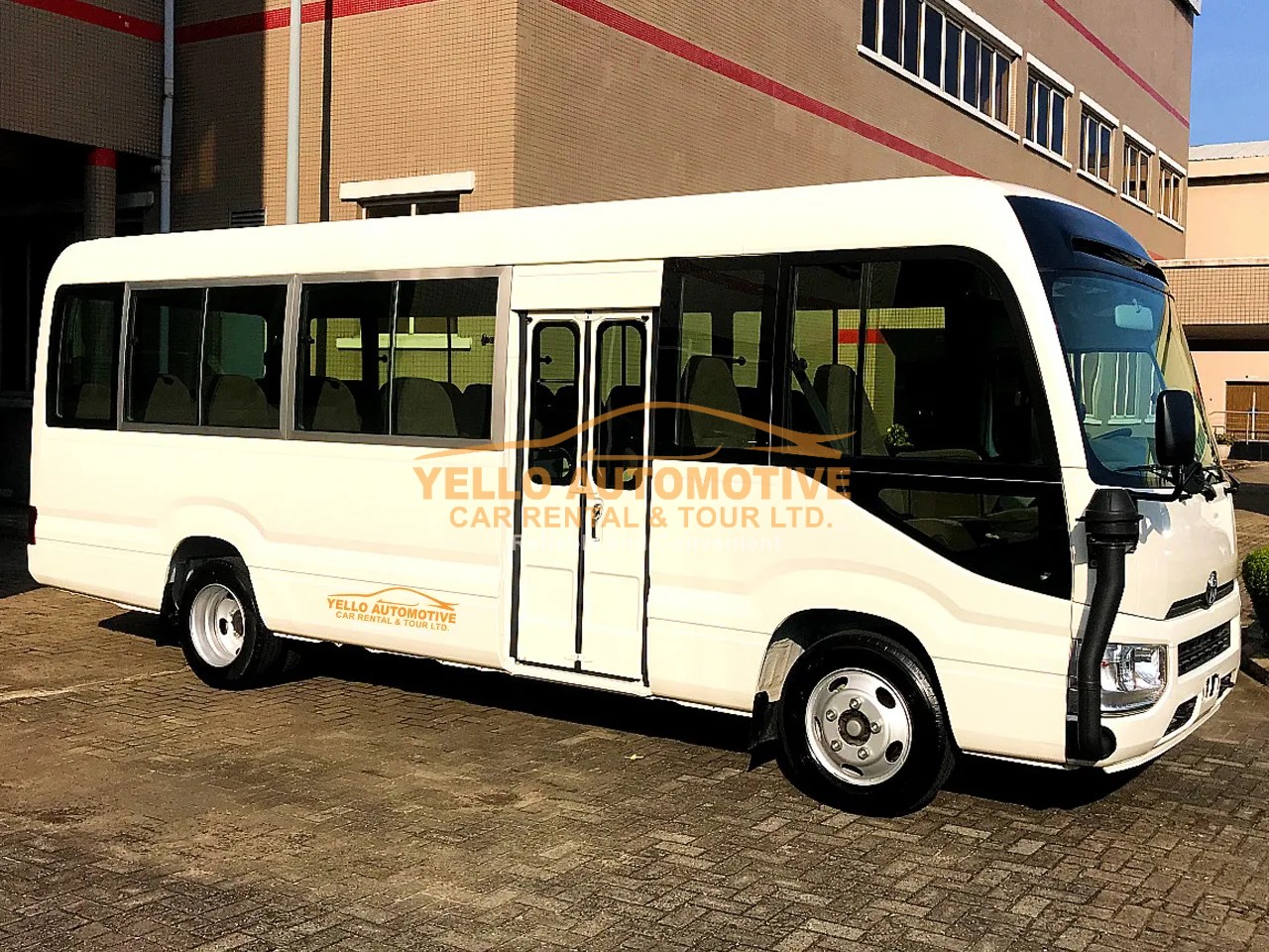 Toyota Coaster or similar coaster / mid-size bus from Yello Automotive in Ghana